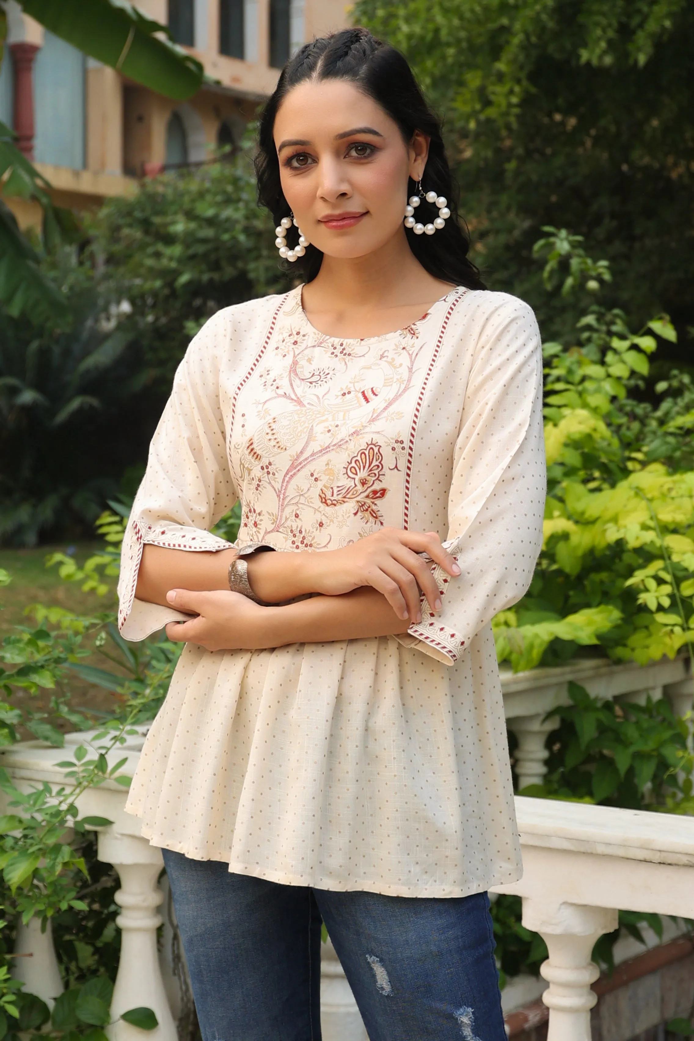 Jashvi Ivory Polka Printed Peplum Rayon Slub Tunic.
