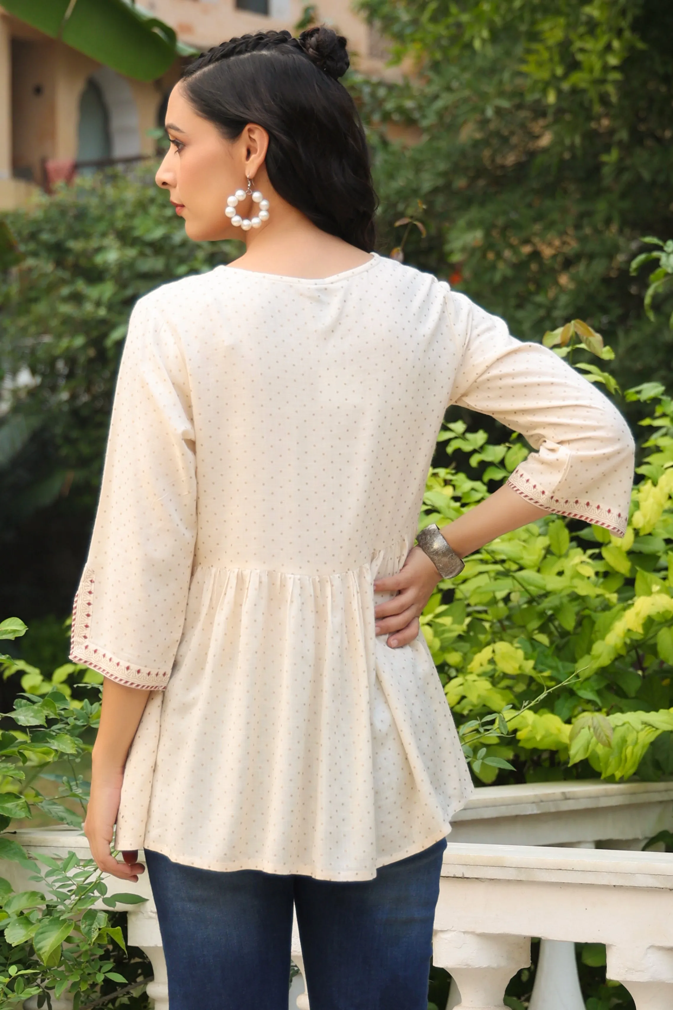 Jashvi Ivory Polka Printed Peplum Rayon Slub Tunic.