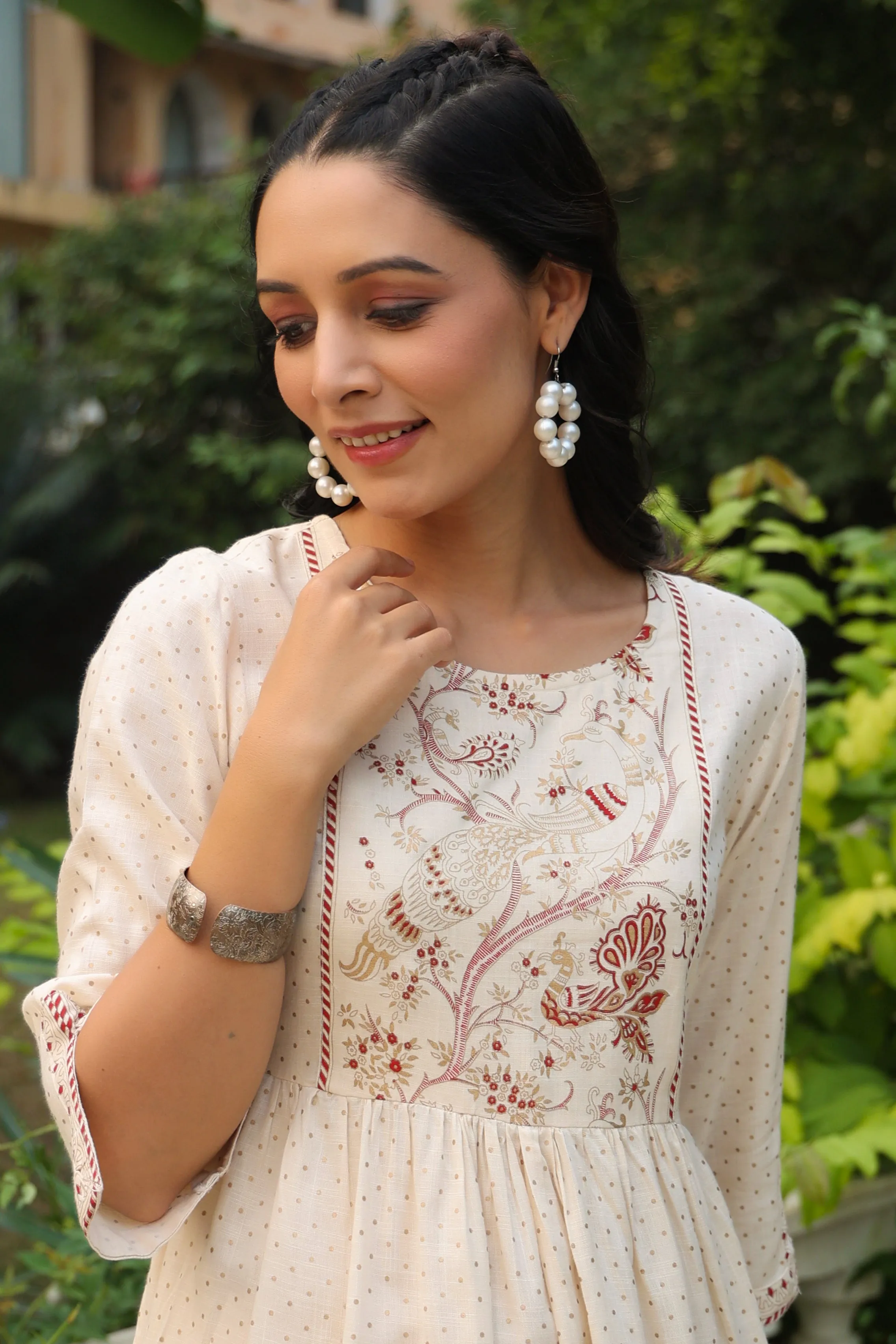 Jashvi Ivory Polka Printed Peplum Rayon Slub Tunic.