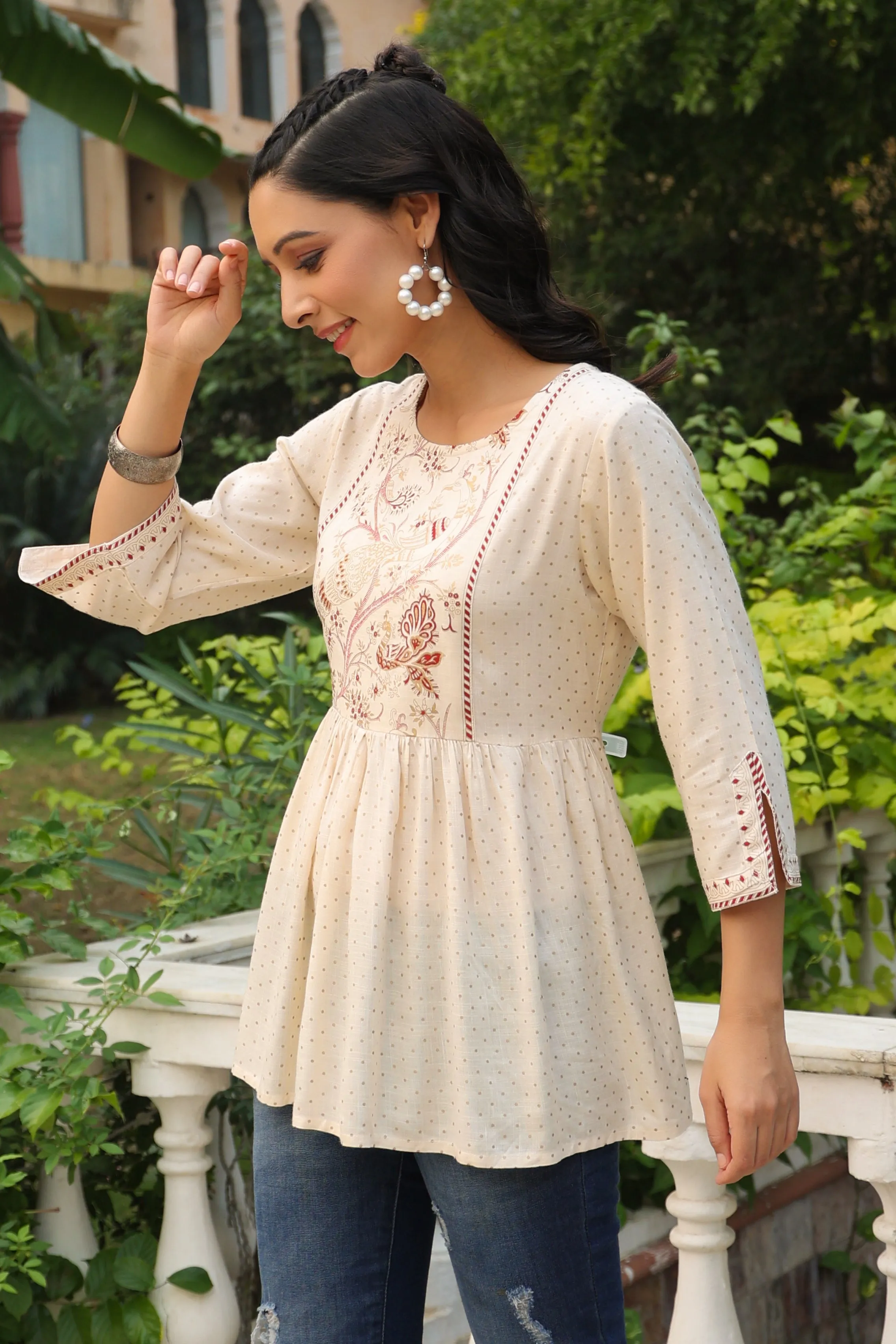 Jashvi Ivory Polka Printed Peplum Rayon Slub Tunic.