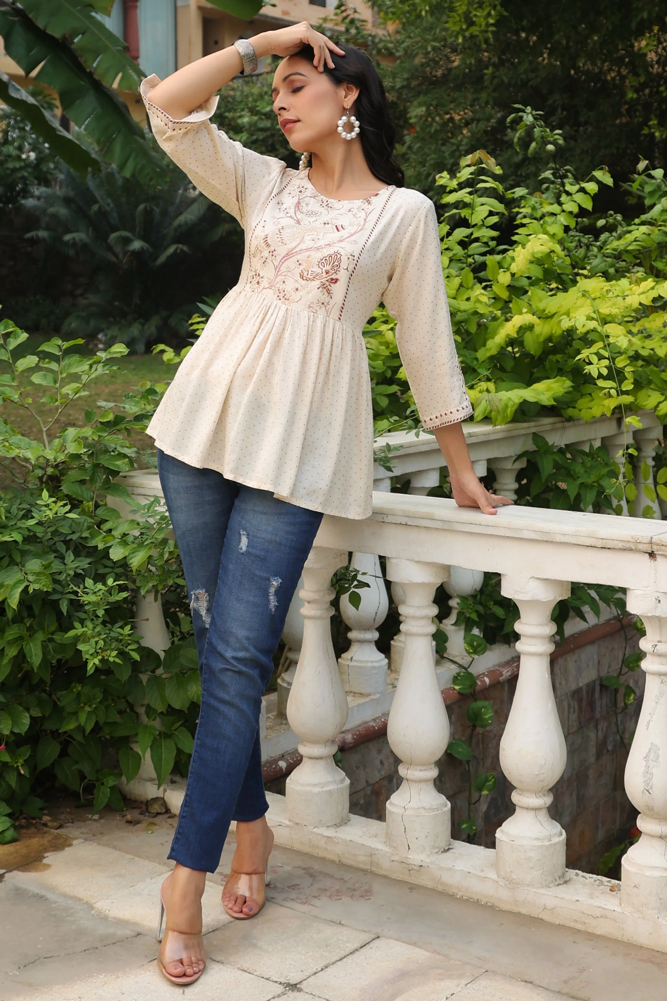 Jashvi Ivory Polka Printed Peplum Rayon Slub Tunic.