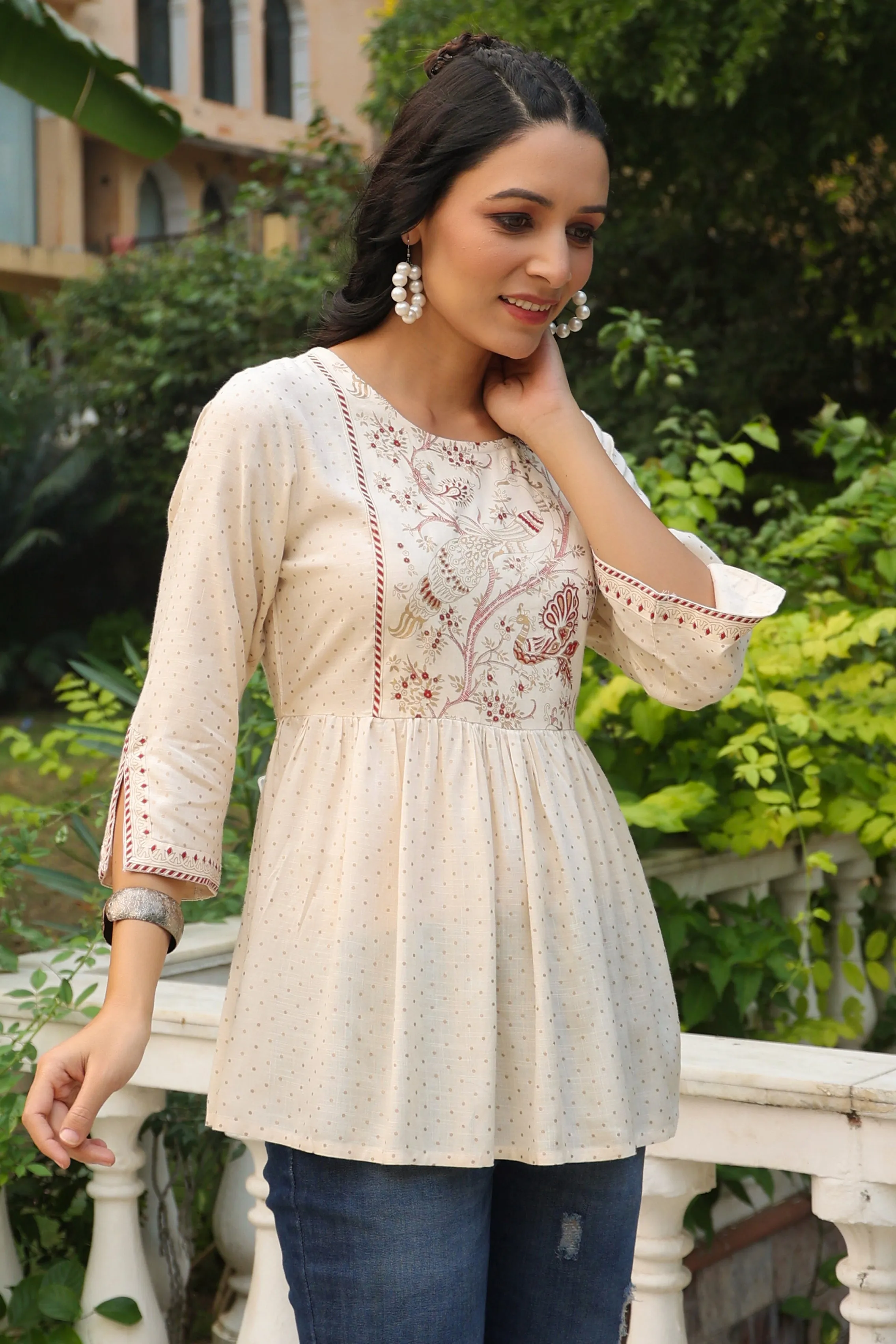 Jashvi Ivory Polka Printed Peplum Rayon Slub Tunic.
